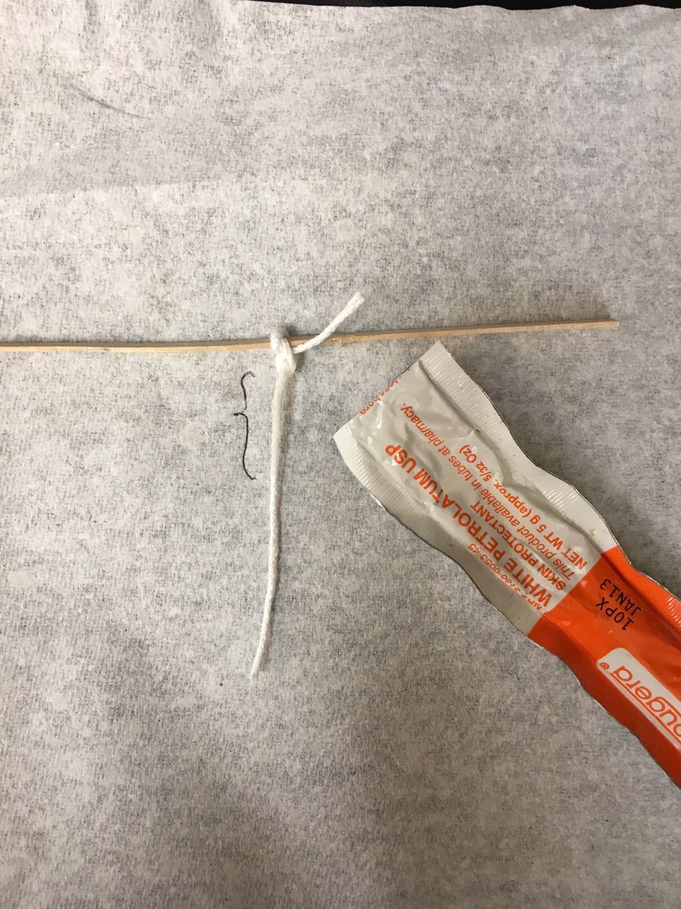 Apply a thin layer of Vaseline to the upper portion of the thread.