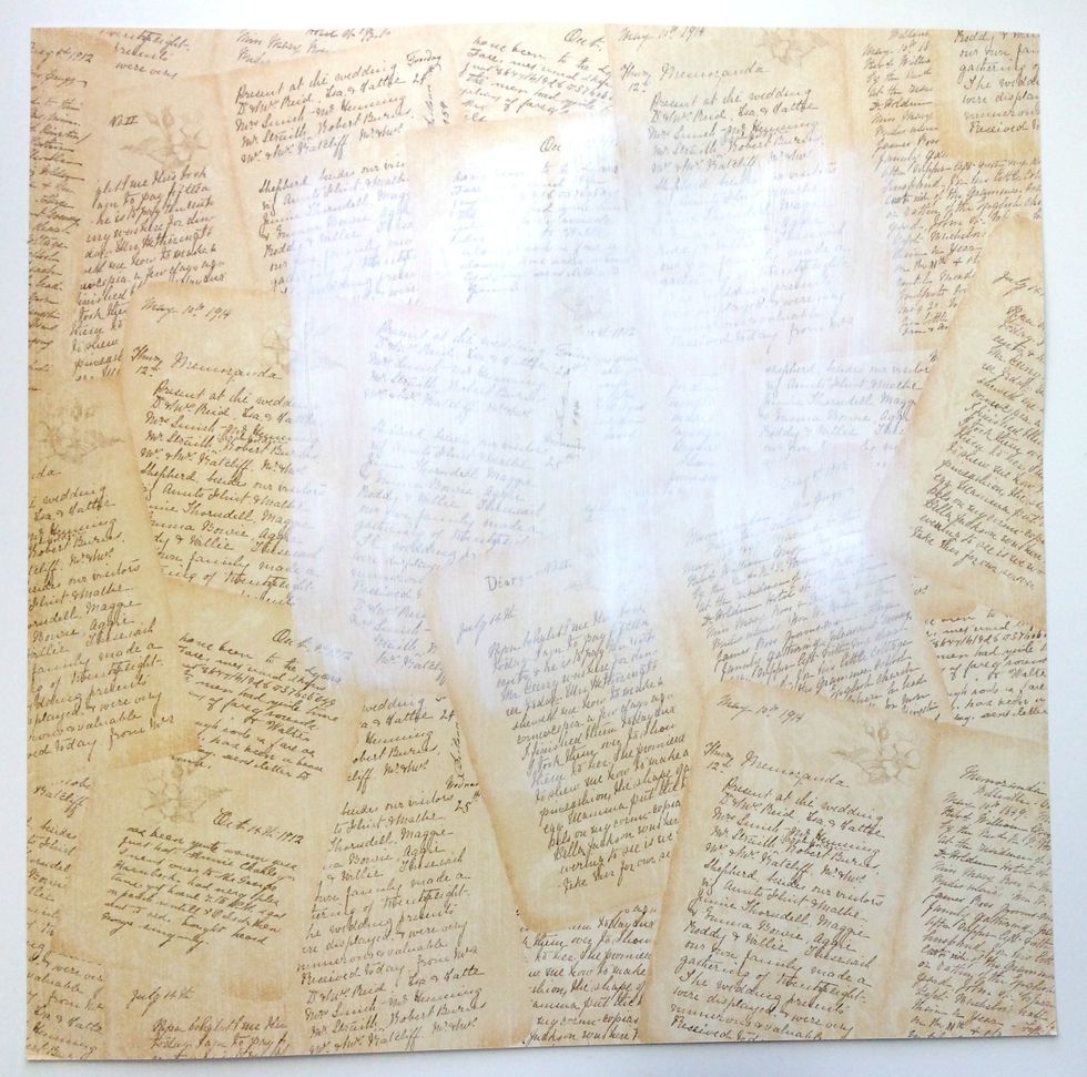 Apply a thin layer of White Gesso to the top middle of the A Moment in Time paper. Set aside to dry.