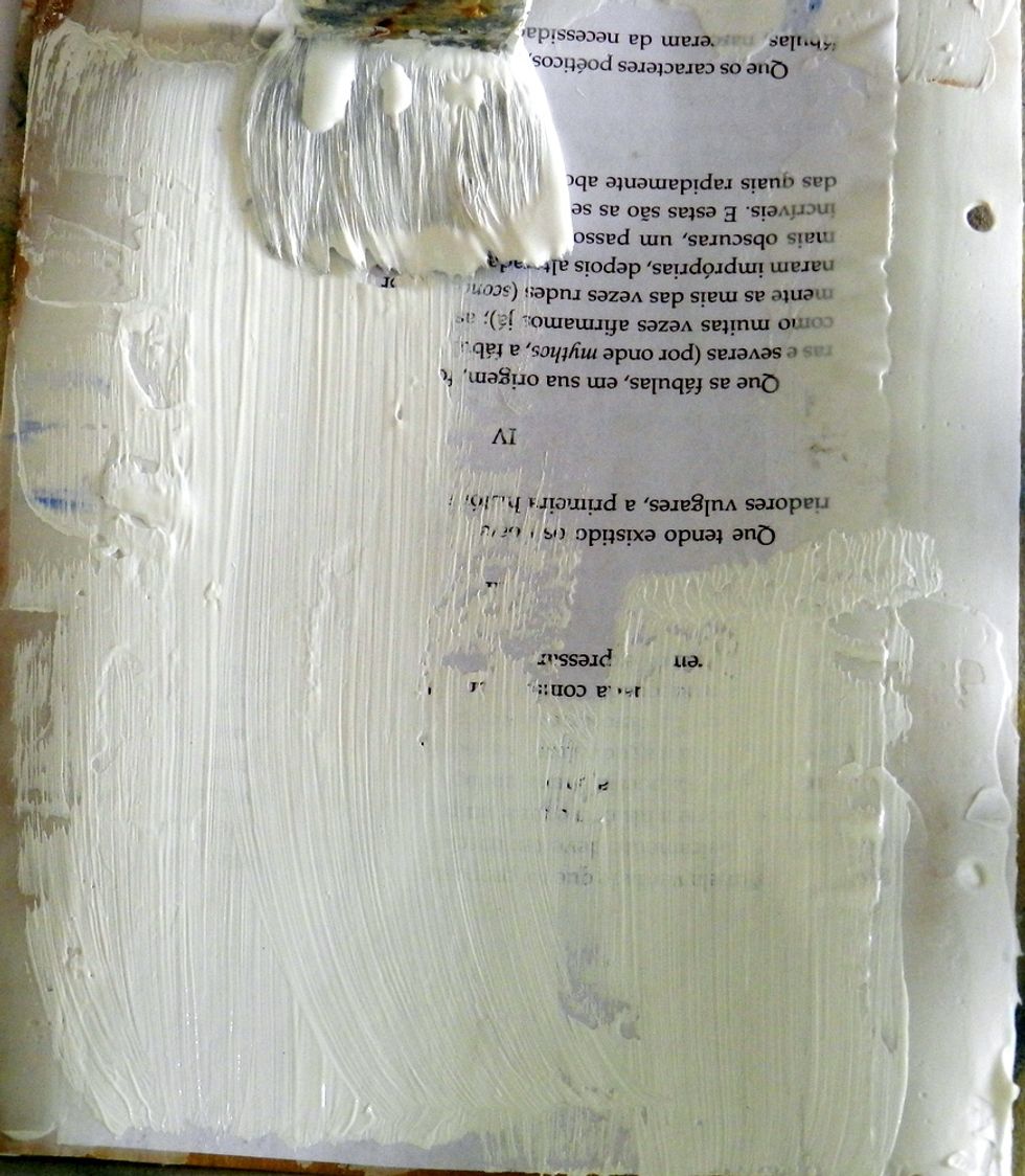 Apply acrylic gesso on the pages.