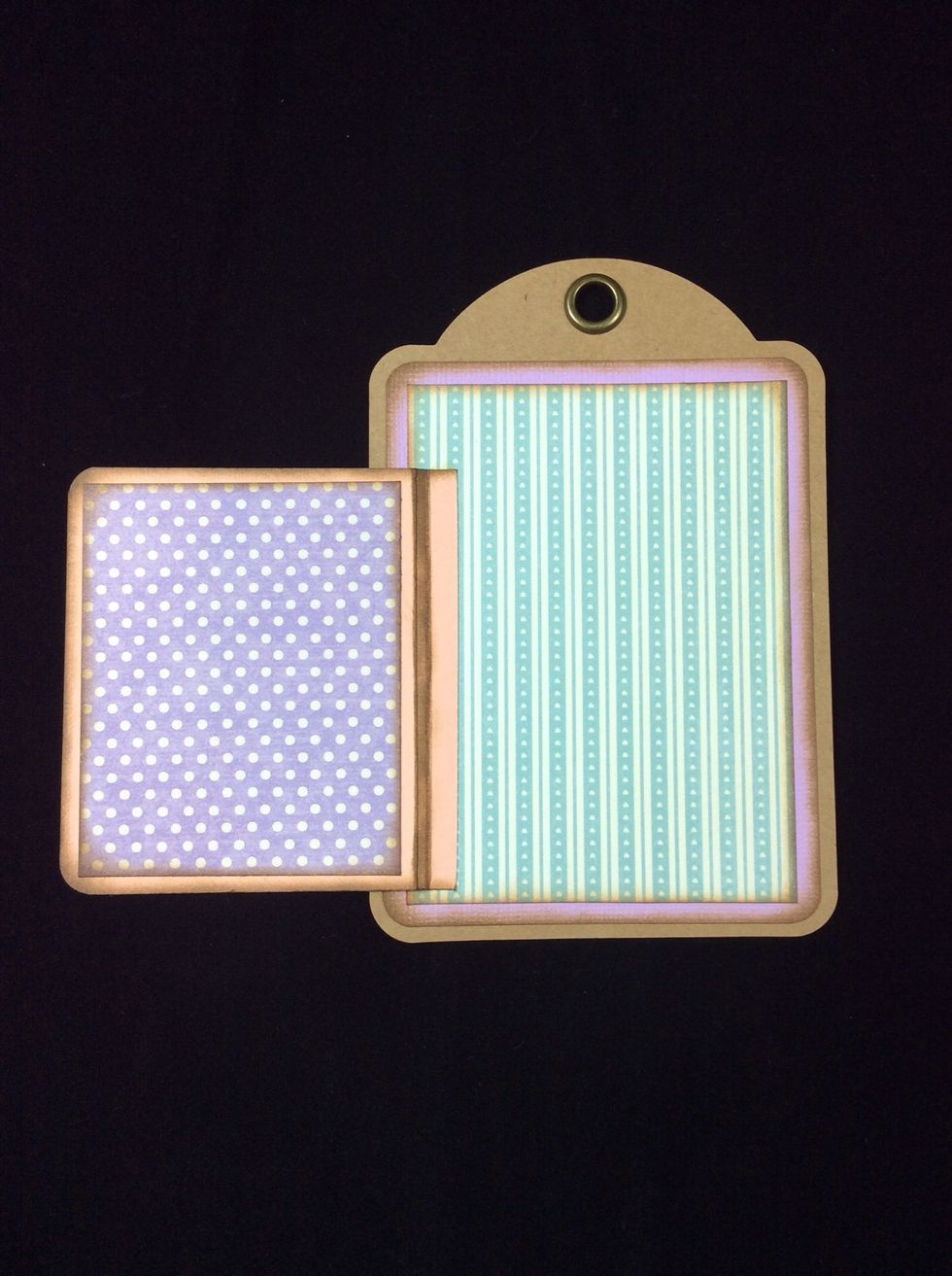 Apply adhesive to the 1/4 inch section on the hinge cover and adhere to tag aligning 1/8 inch from base of patterned mat.