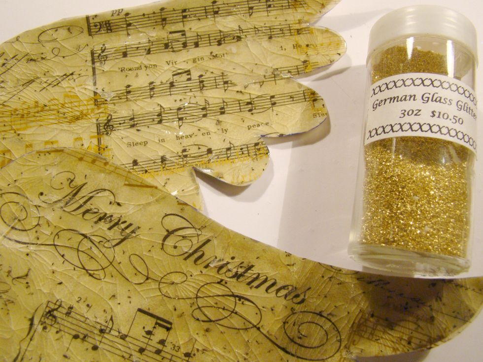 Apply adhesive to the edges of your wings and add glitter.