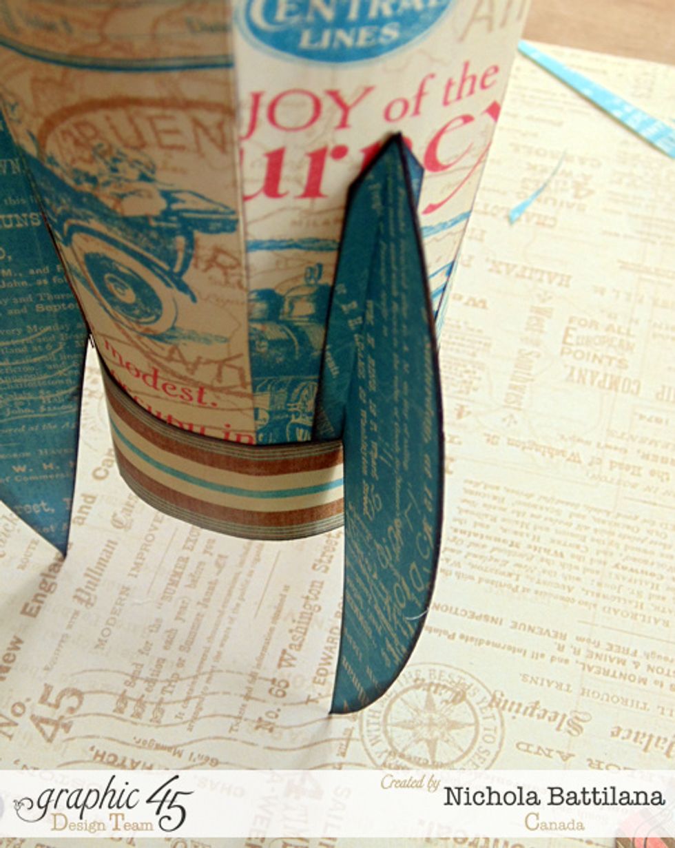 Apply adhesive to the folded edge and attach your three fins to the rocket body. I've used the E-Z Squares\u00ae Refillable Dispenser