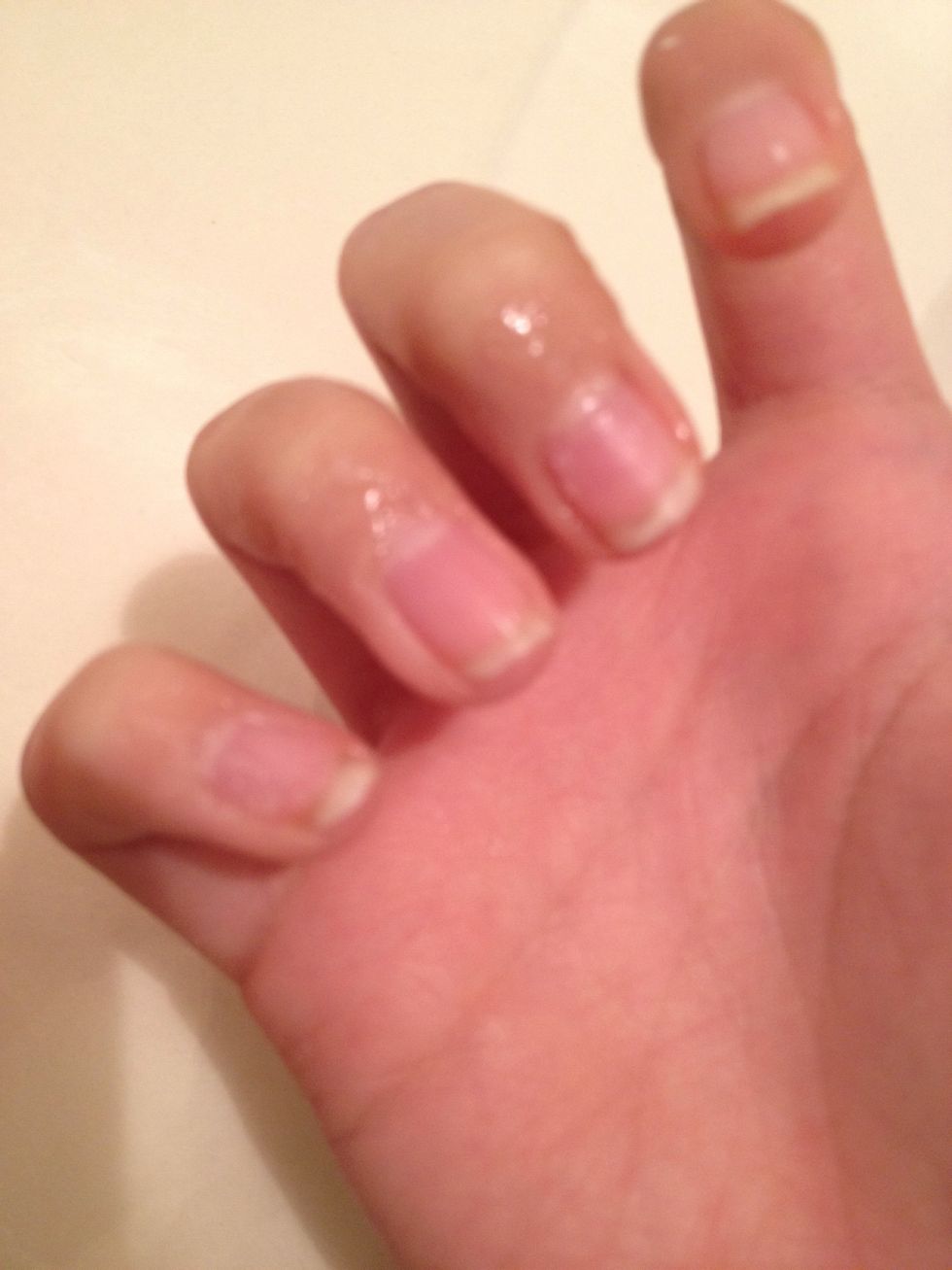 Apply all around your nail. If you get some on your nail just wipe with a Q-tip