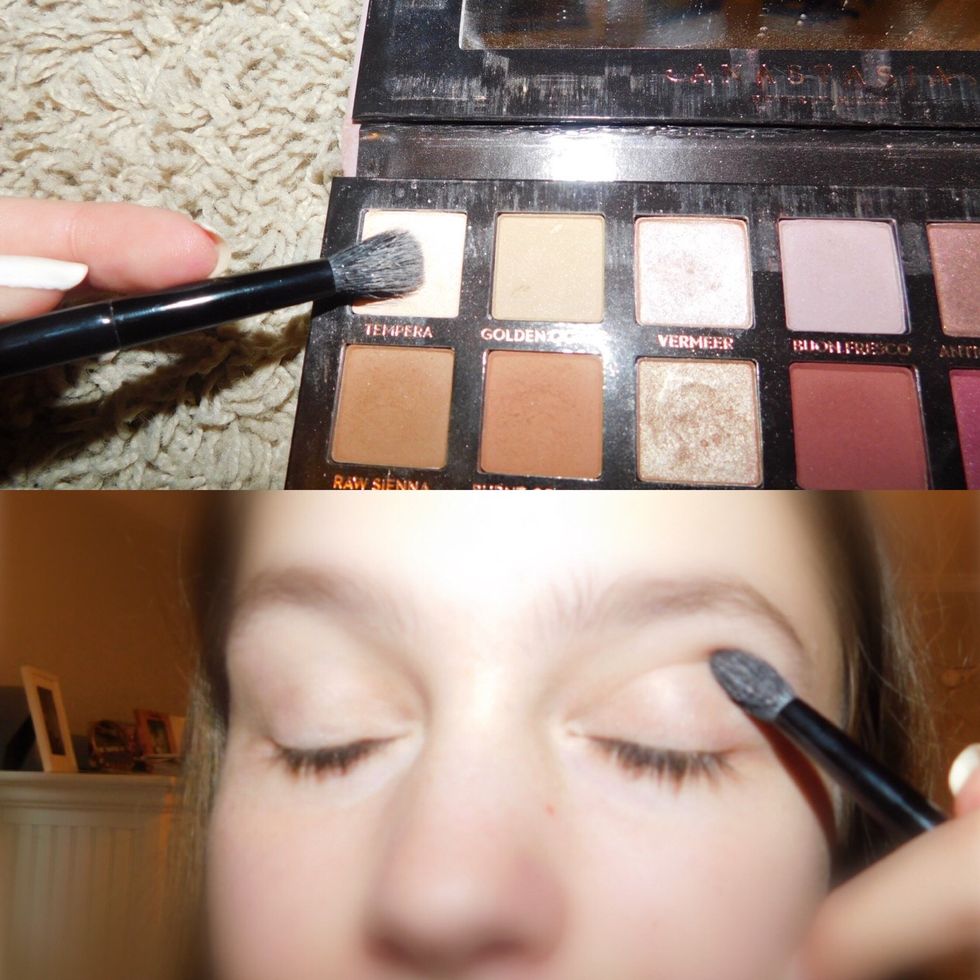 Apply an all white color, or a color close to your skin tone. Apply it all over the lid and up to the brow bone. This is the base.