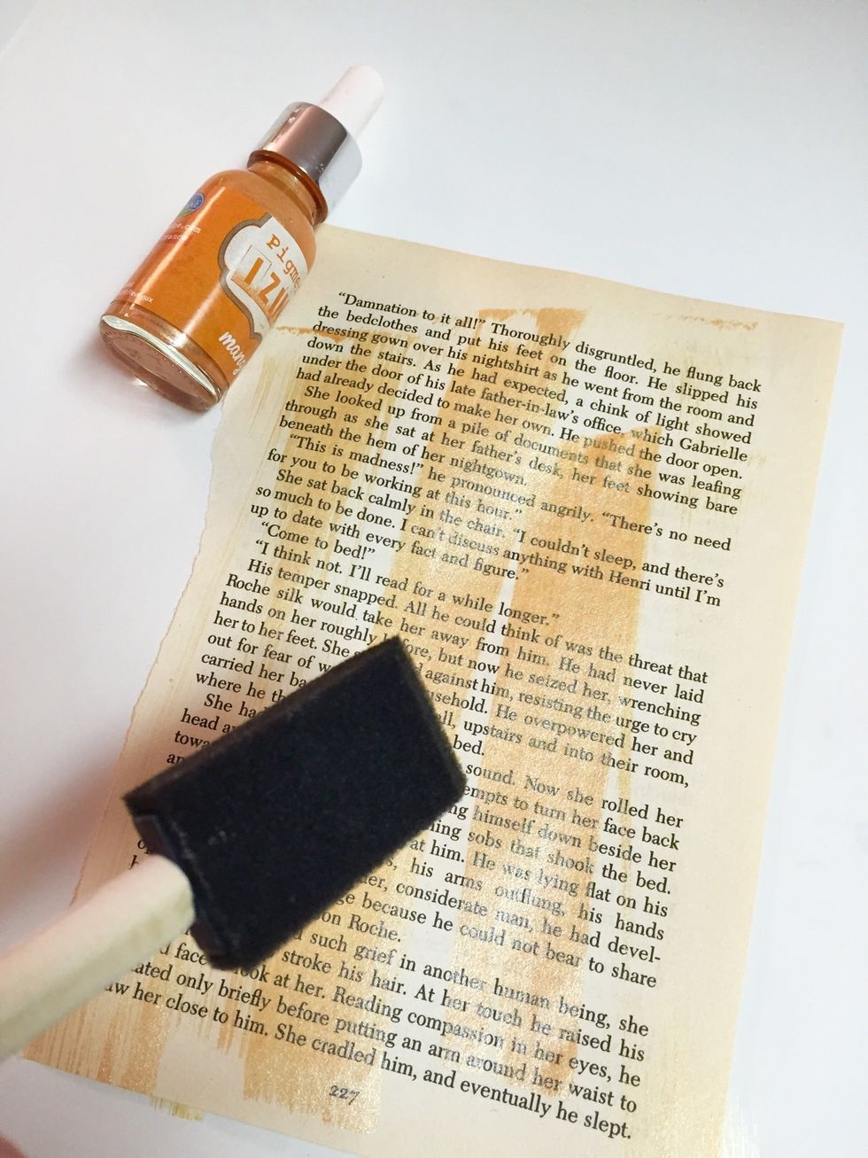 apply and work with Izink Inks on Inking Palette...  paint 3-4 book pages with different colors of Izink, varying intensity of colors on pages.