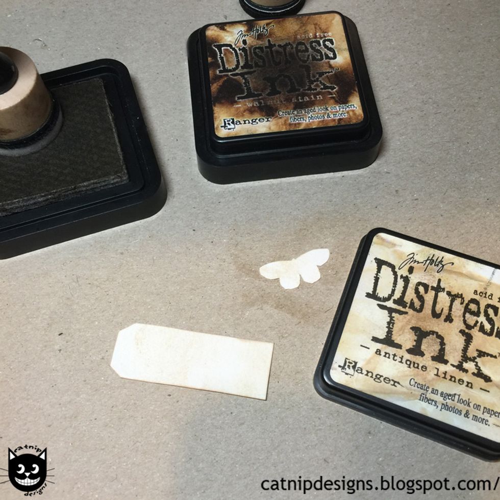 Apply Antique Linen to the back of the paper using the Tim Holtz - Mini Ink Blending Tool...