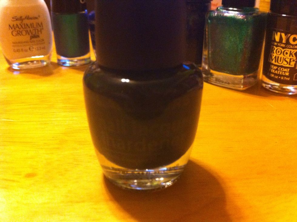 Apply black nail polish. I used two coats of LA Color.
