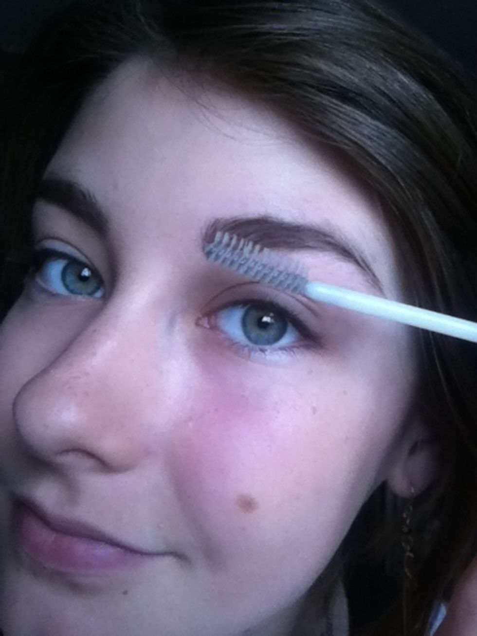 Apply brow gel or clear mascara to set them in place.