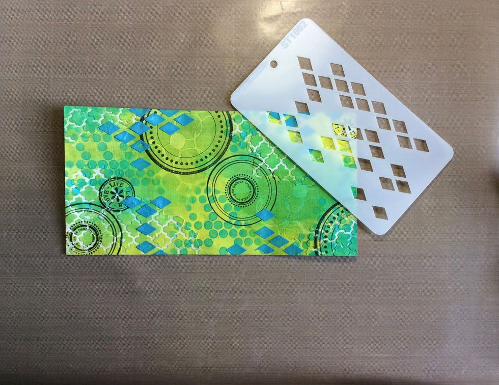 Apply coloured texture paste using another Scrapmatts stencil. I used ST1002.