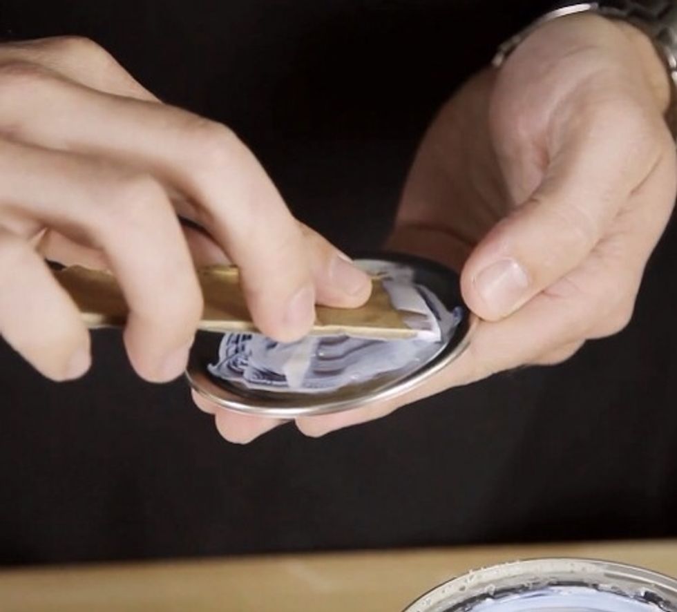 Apply contact adhesive to the sandpaper and lid, and attach the two, making sure the gritty part of the sandpaper faces up.