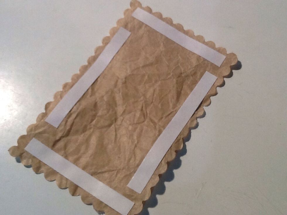 Apply double sided tape/glue to the back of the paper.