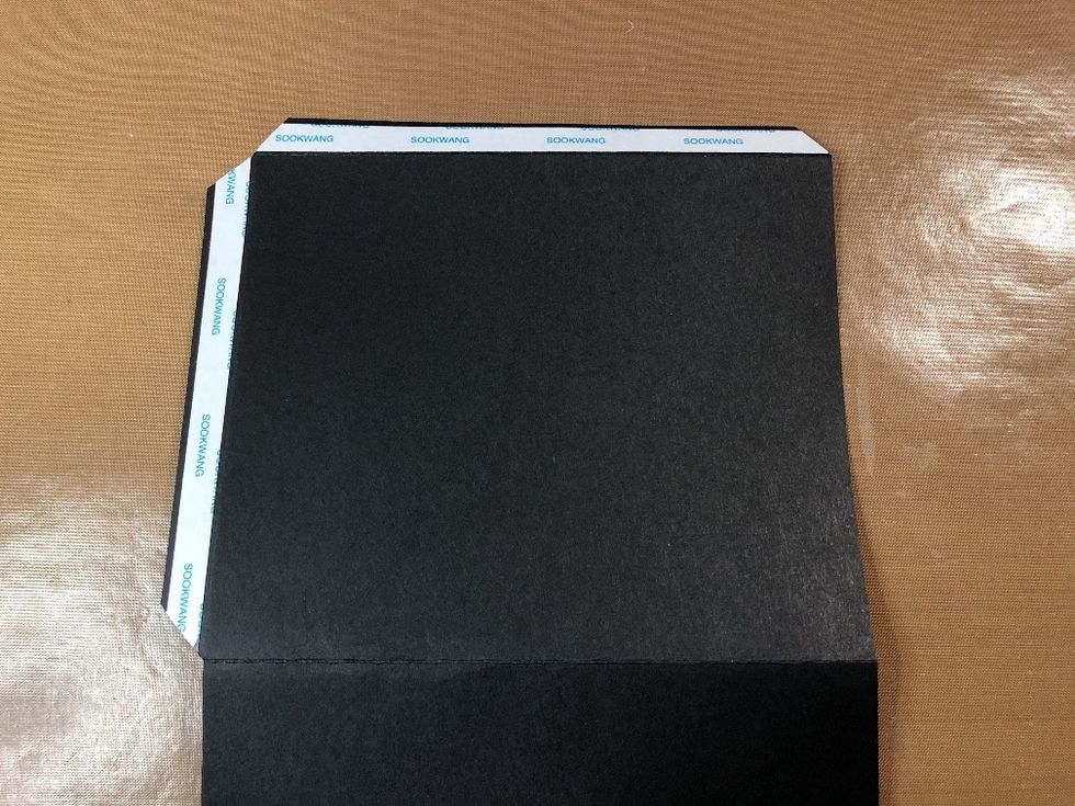 Apply double-sided tape to the glue flaps and taper the corners.