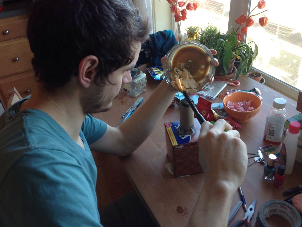 Apply flame to old wax and let it pour into the cardboard roll mold