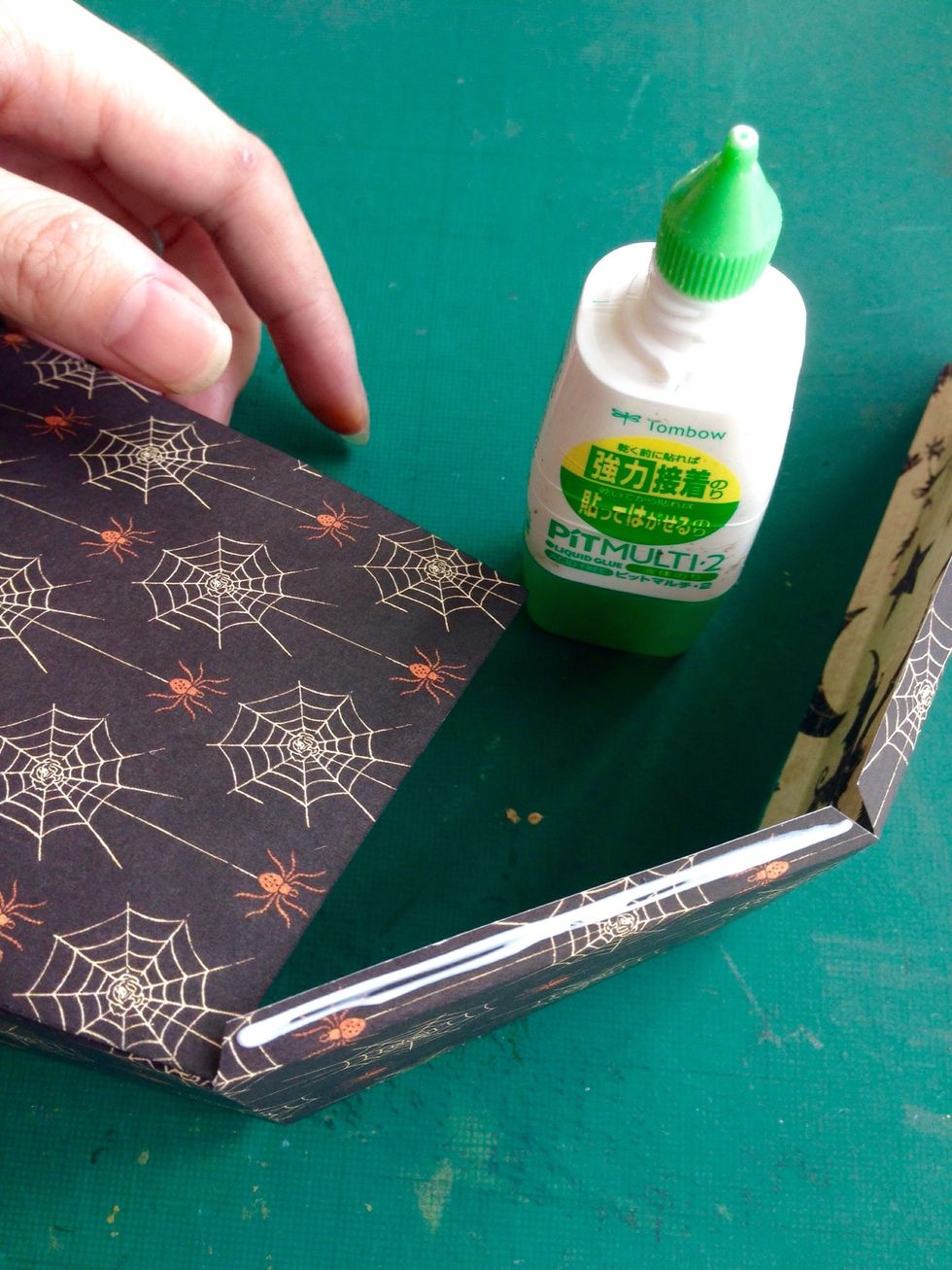 Apply glue at the base of the strip as shown...