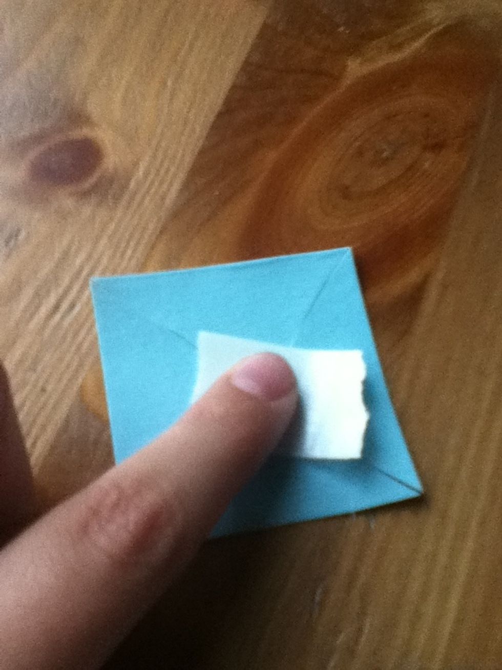 Apply glue dot to center.