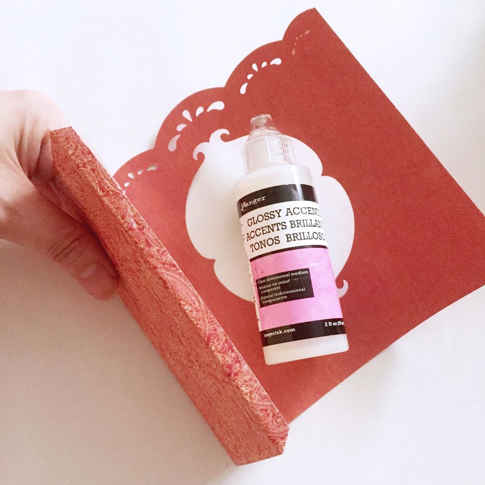 Apply glue/glossy accent on the other end as shown.