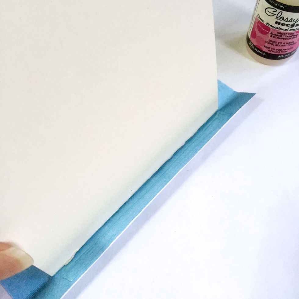 Apply glue onto the 0.5" flap of the pattern paper.