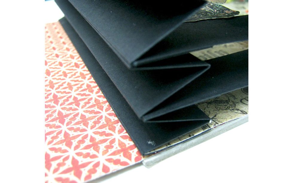 Apply glue to back side of tunnel book and adhere to chipboard.