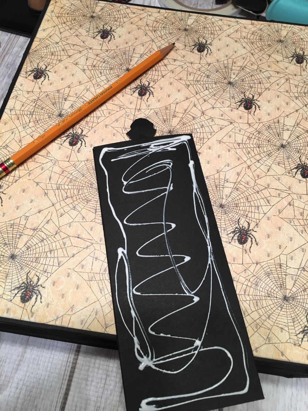 Apply glue to just the back of the main piece.