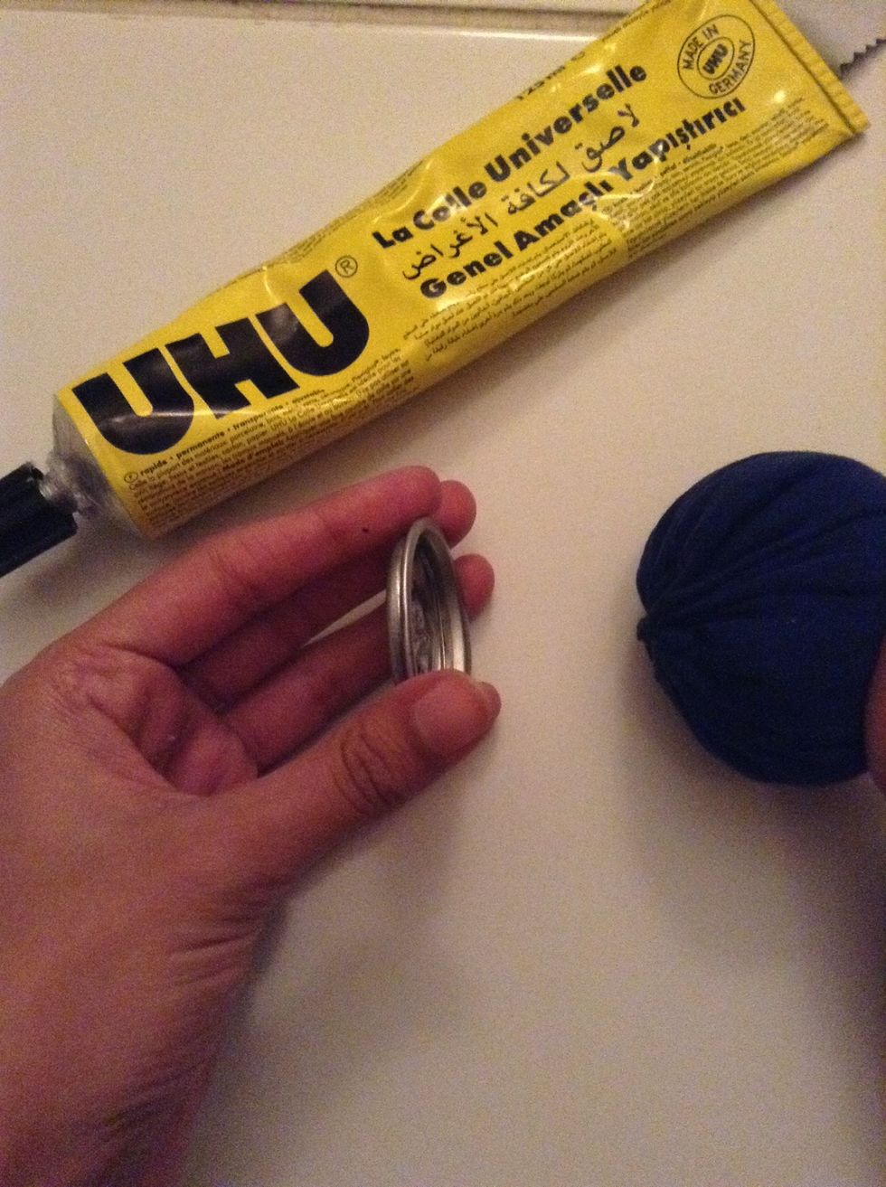 Apply glue to the hallow side of the cap and attach it to the pouch on the closed end.