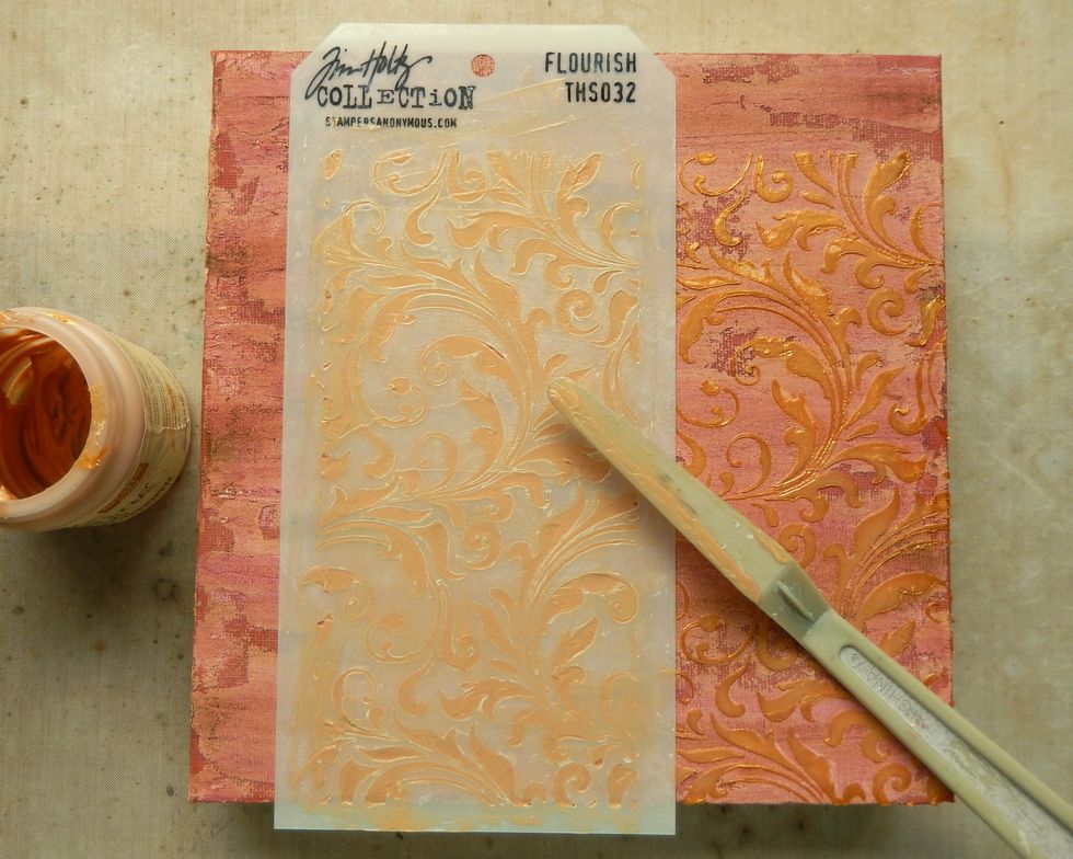 Apply Gold Embossing Paste through the Flourish Stencil, using the pattern repeat to cover the whole canvas. To avoid smudges allow each section to dry before applying the next layer of paste.