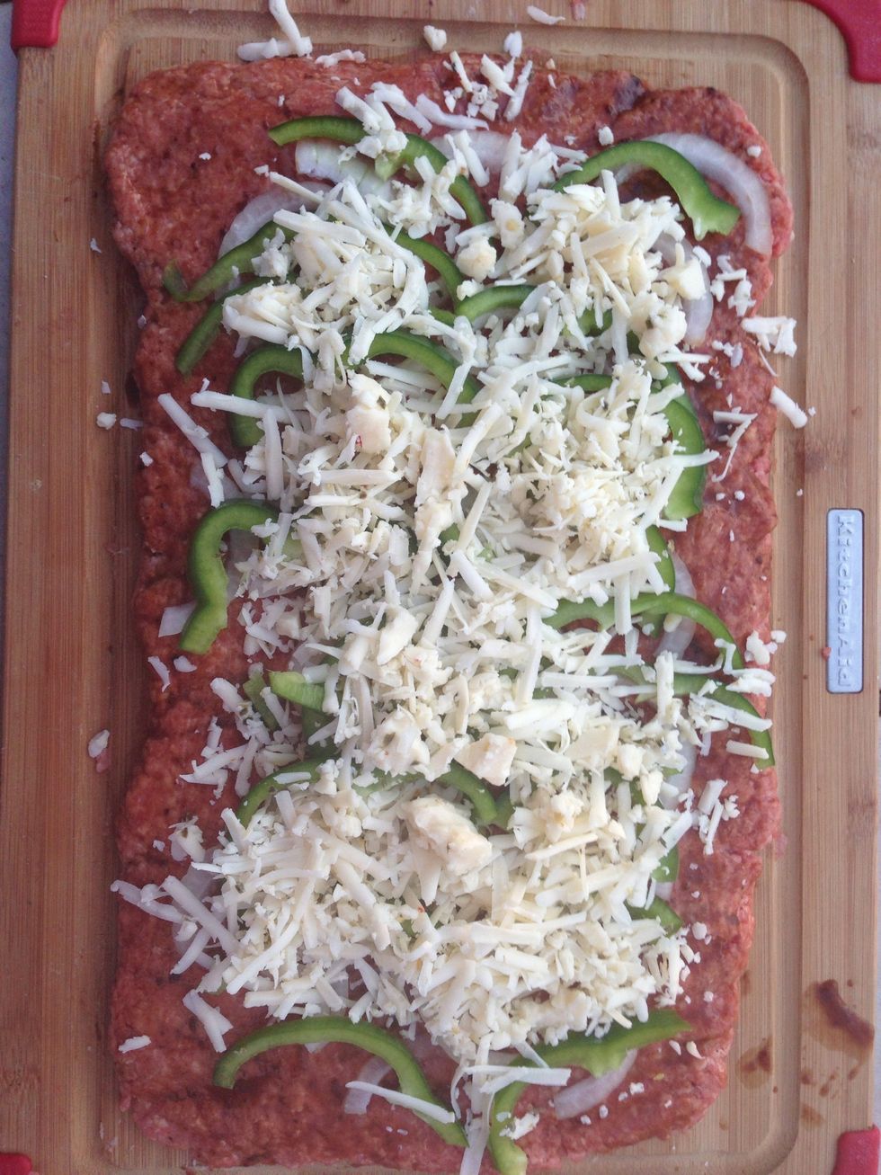 Apply grated pepper jack cheese.