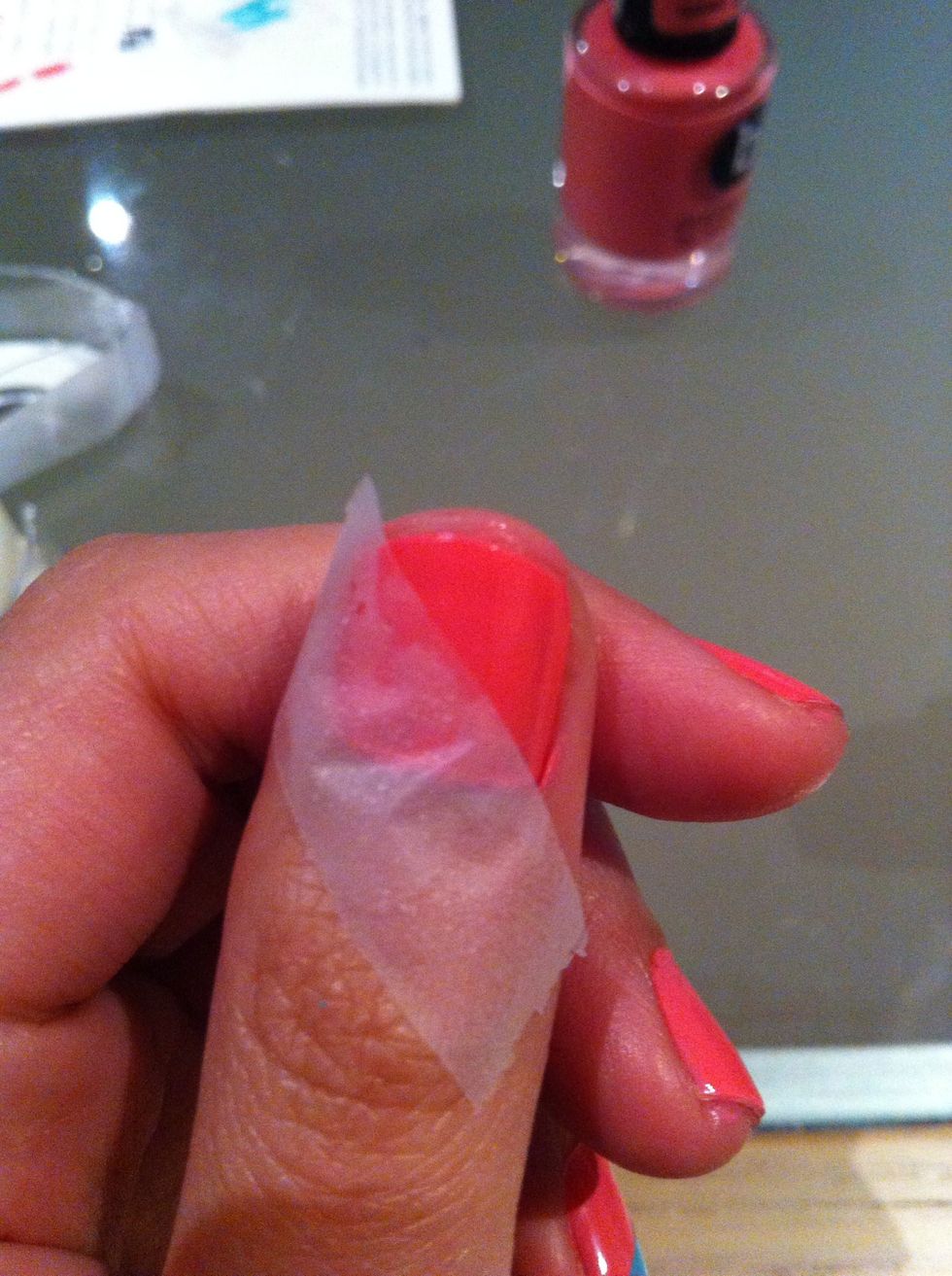 Apply it in the direction you want on the nail, press the edges well. Paint a THIN coat of the other colour (this is why you want the second colour to be darker) give it a second to dry