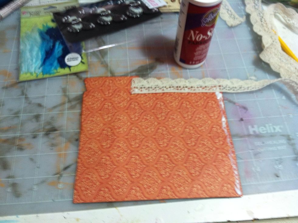 Apply lace to the backside of the cut out from the 12x12 Couture sheet.