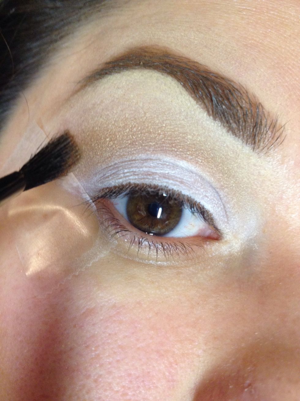Apply lightest shade of brown to crease.