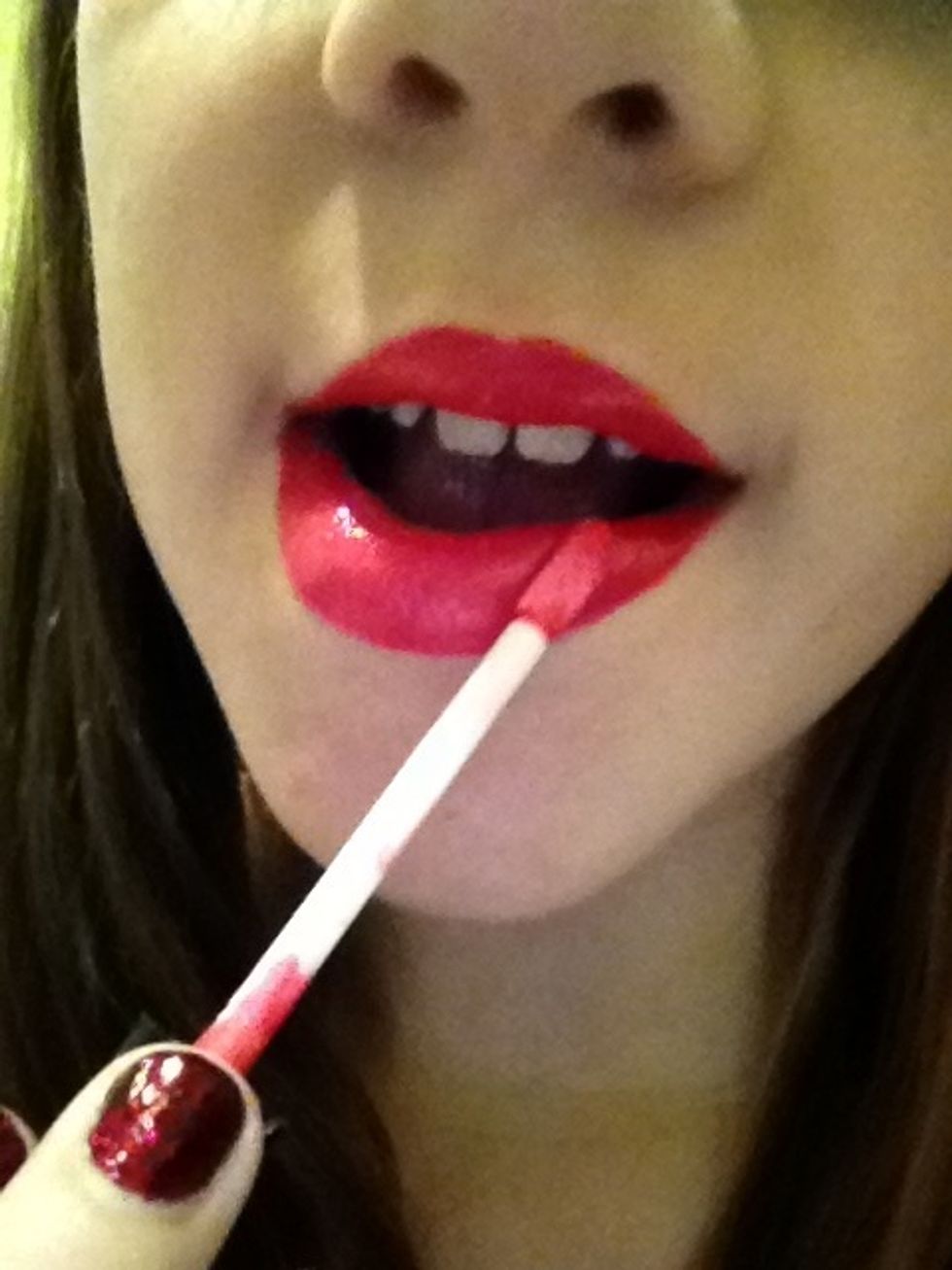 apply lip gloss for a glossy look. (optional)