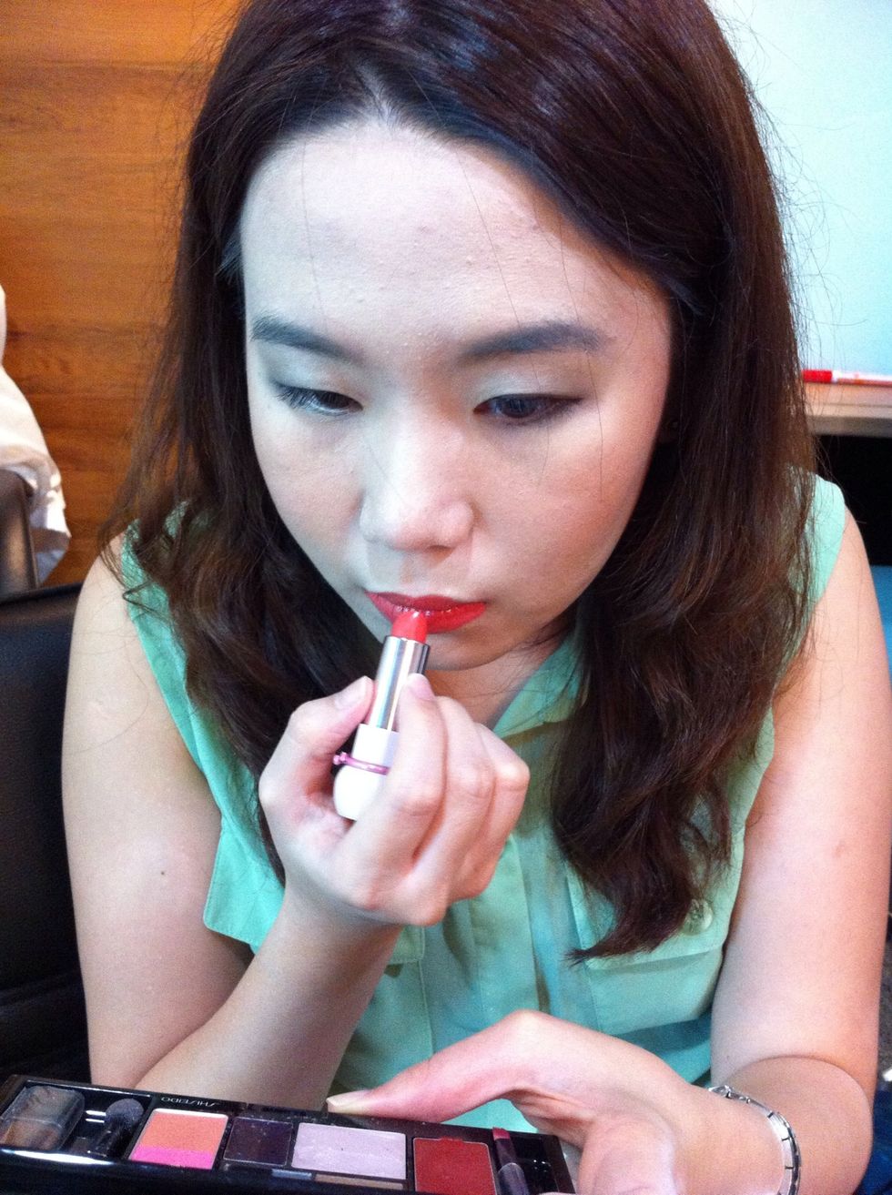 Apply lipstick in bright tone