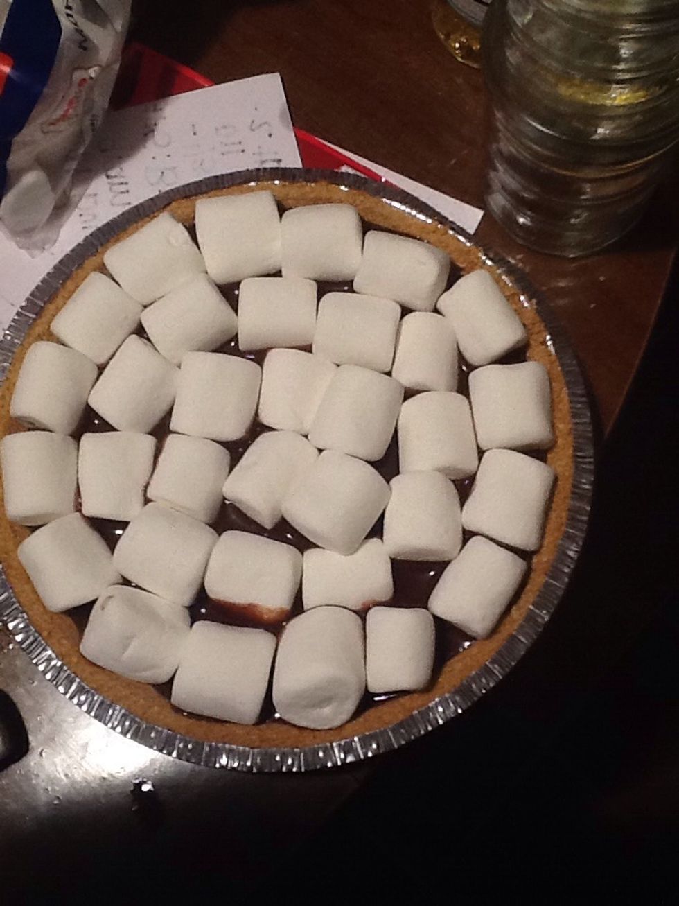 Apply marshmallows around the top of the pie