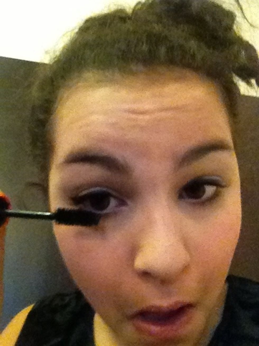 Apply mascara first to the bottom lashes