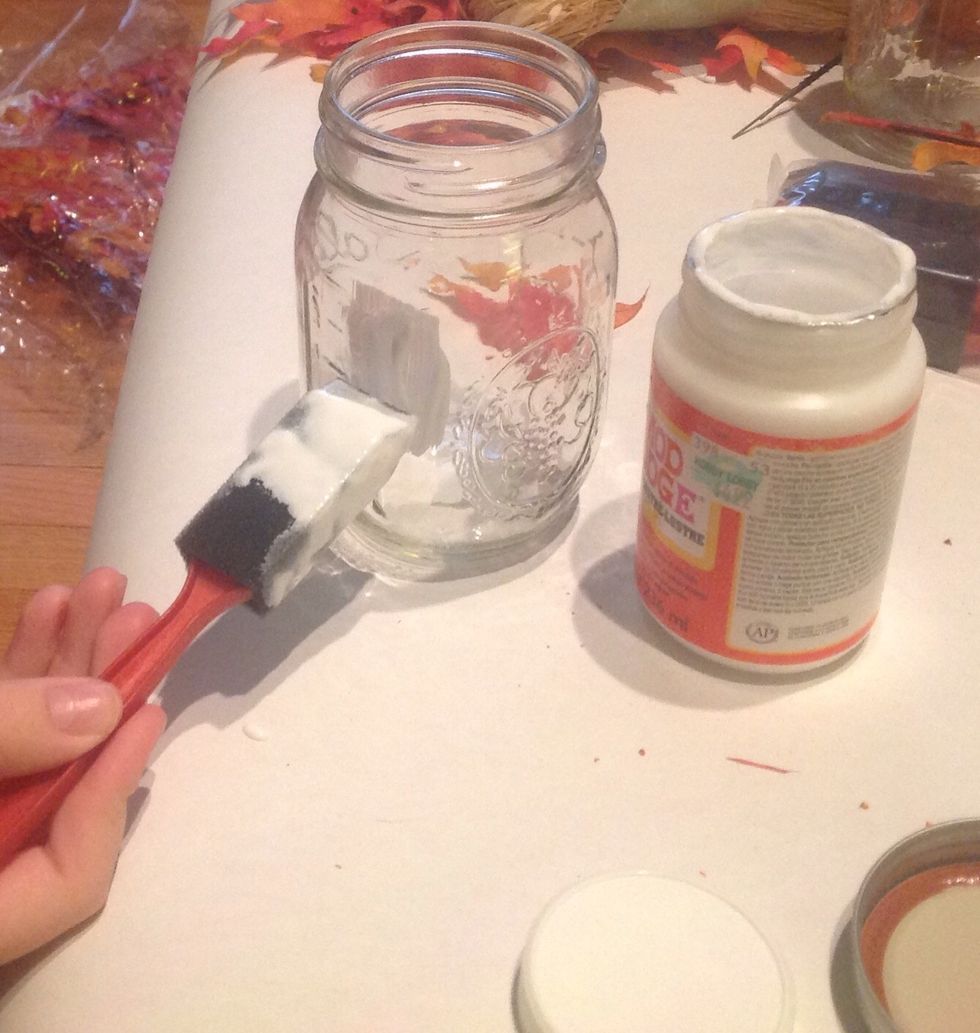 Apply Mod Podge to the jar in small sections.
