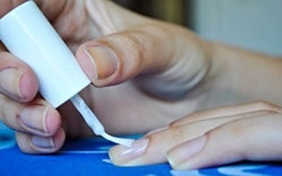 Apply more than one coat of nail polish, or a base coat two coats of nail polish, and then a top coat. This simply stops chipping and will make your nails look stronger.