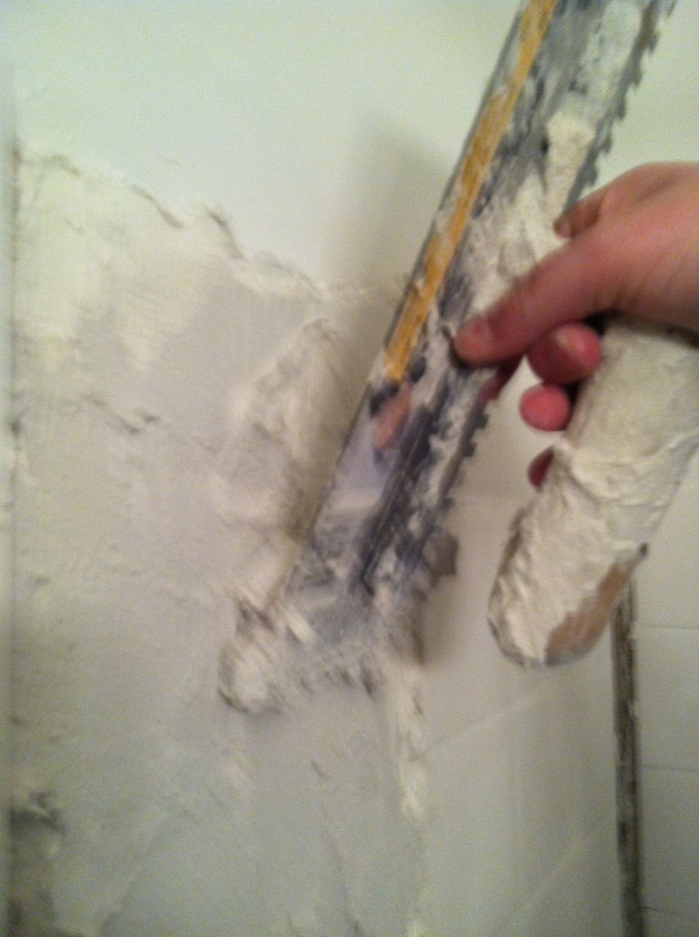 Apply mortar using flat edge.