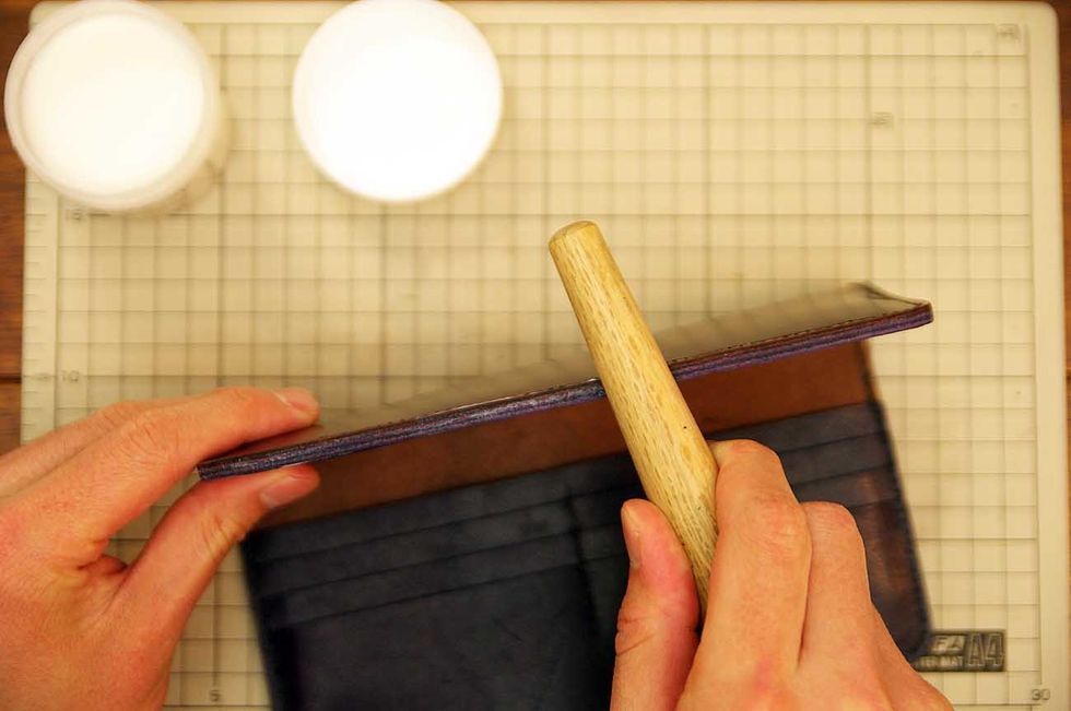 Apply oil to the leather edge and polish it with the stick of the wood.
