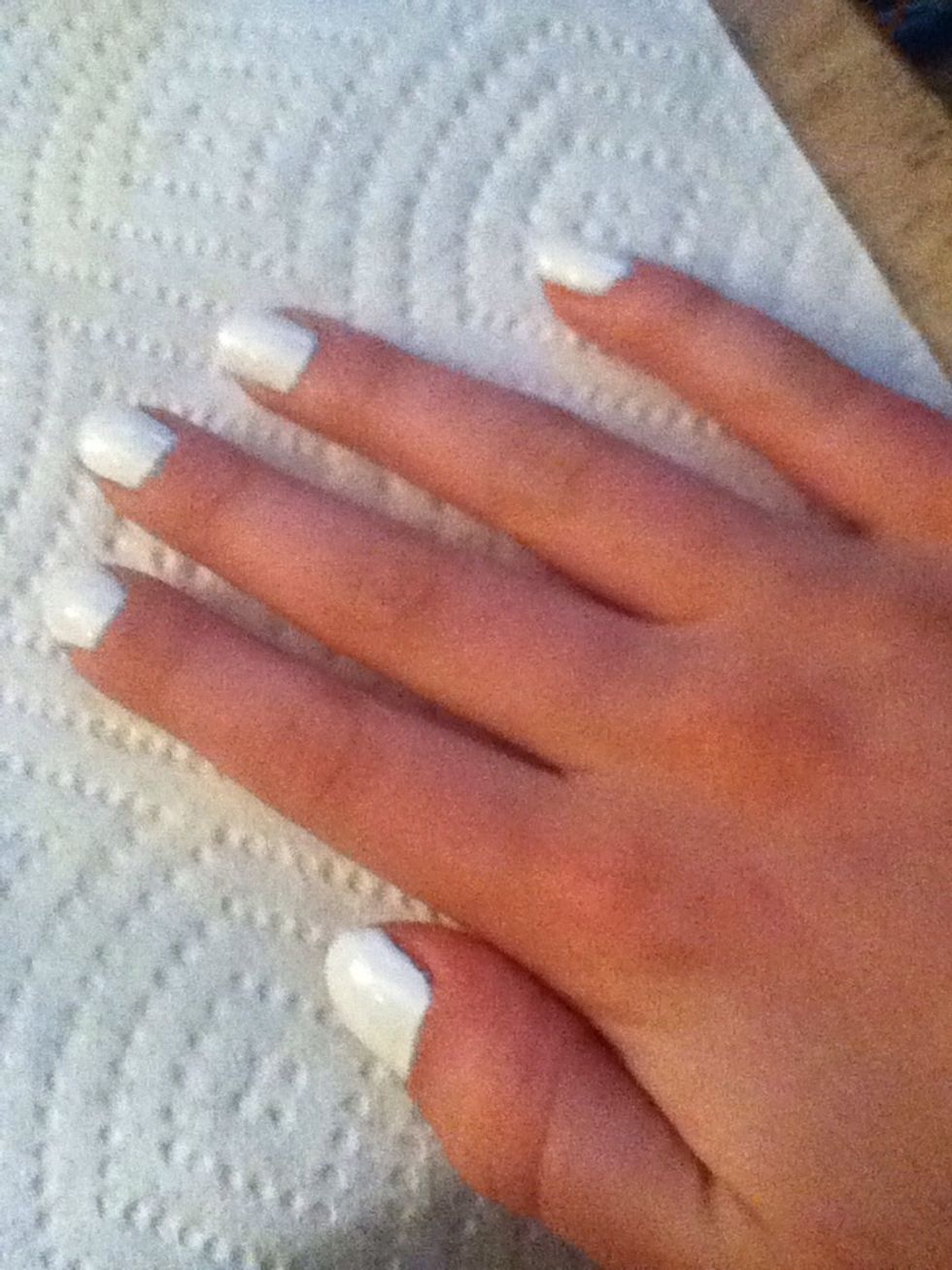 Apply one coat of white nail polish and allow to dry. Next, apply a second coat and also allow to dry.
