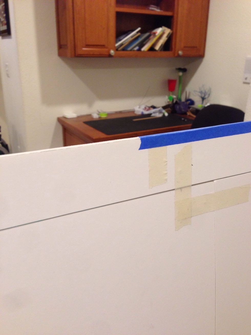 Apply painters tape around the edges of the board. This adds durability to the board and prevents the boards from separating.