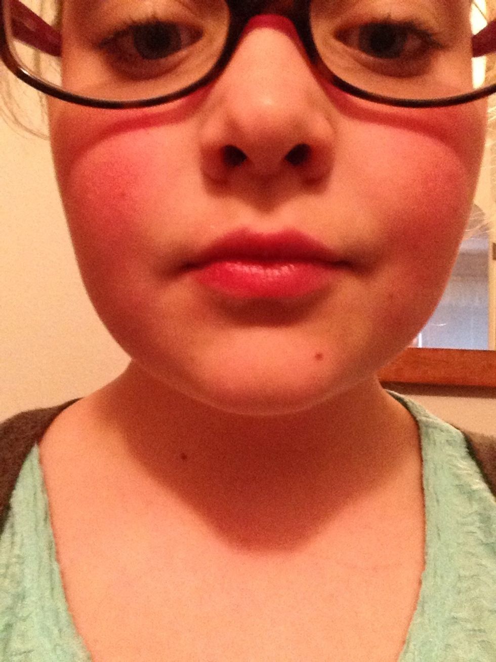 Apply pink lipgloss