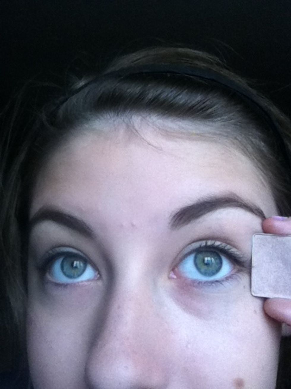 Apply pinky shimmery shade to eyelids.