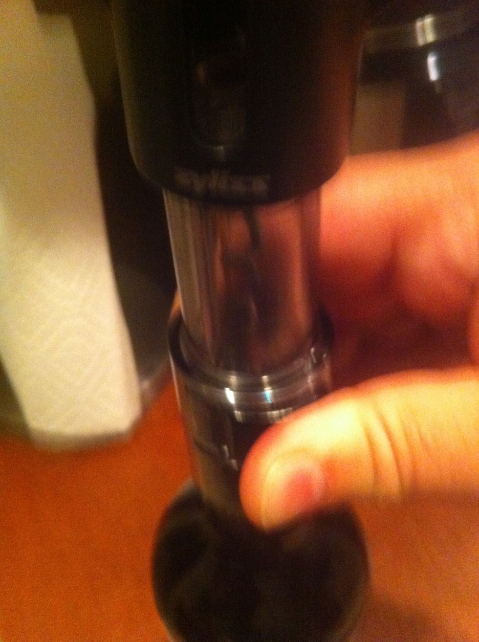 Apply pressure to cutter, trying not to tickle or anything and rotate the bottle 720 degrees in a clockwise direction.