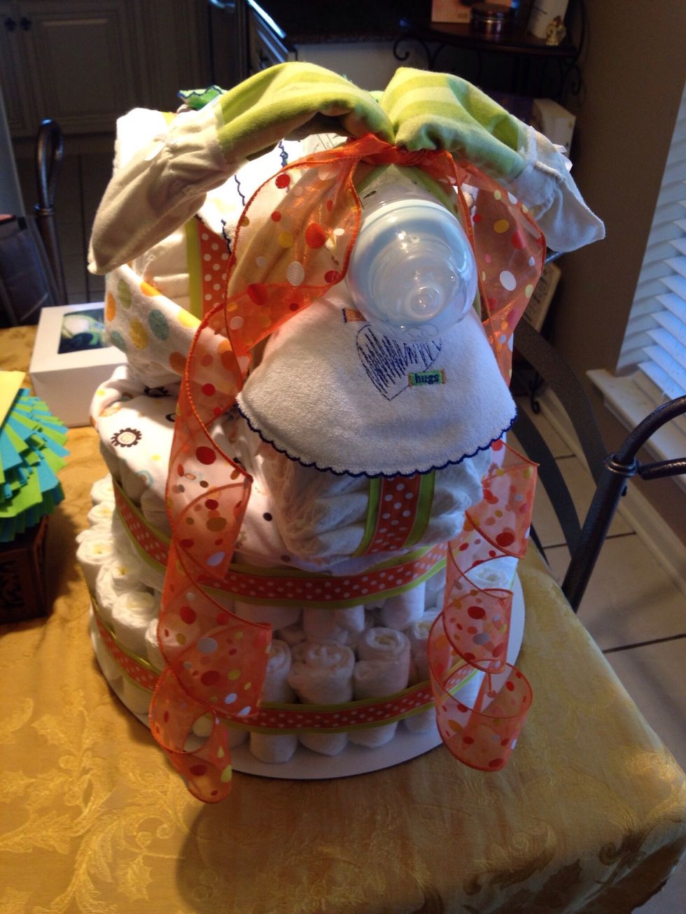 Apply ribbon under handle bars. And make a bow