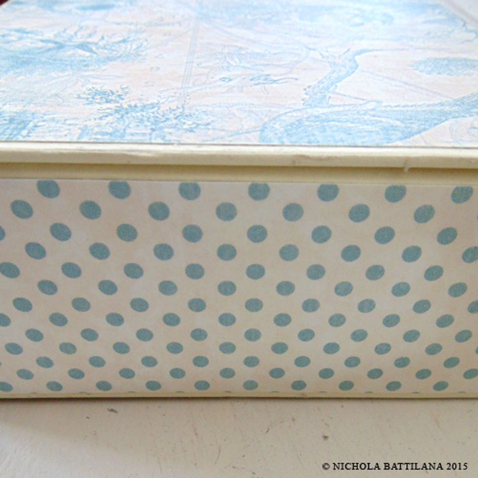 Apply Robin's Egg to the exterior sides. We don't have to worry about folding or creases so you can wrap the paper around the corners.