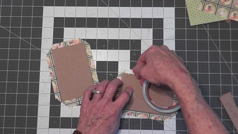 Apply Scor-tape to all four sides of the paper edges on both pieces.