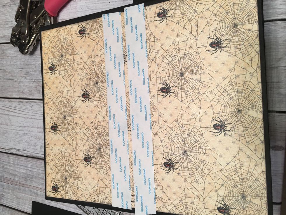 Apply scor-tape to the back side of your album so it lines up with the magnets on the front.