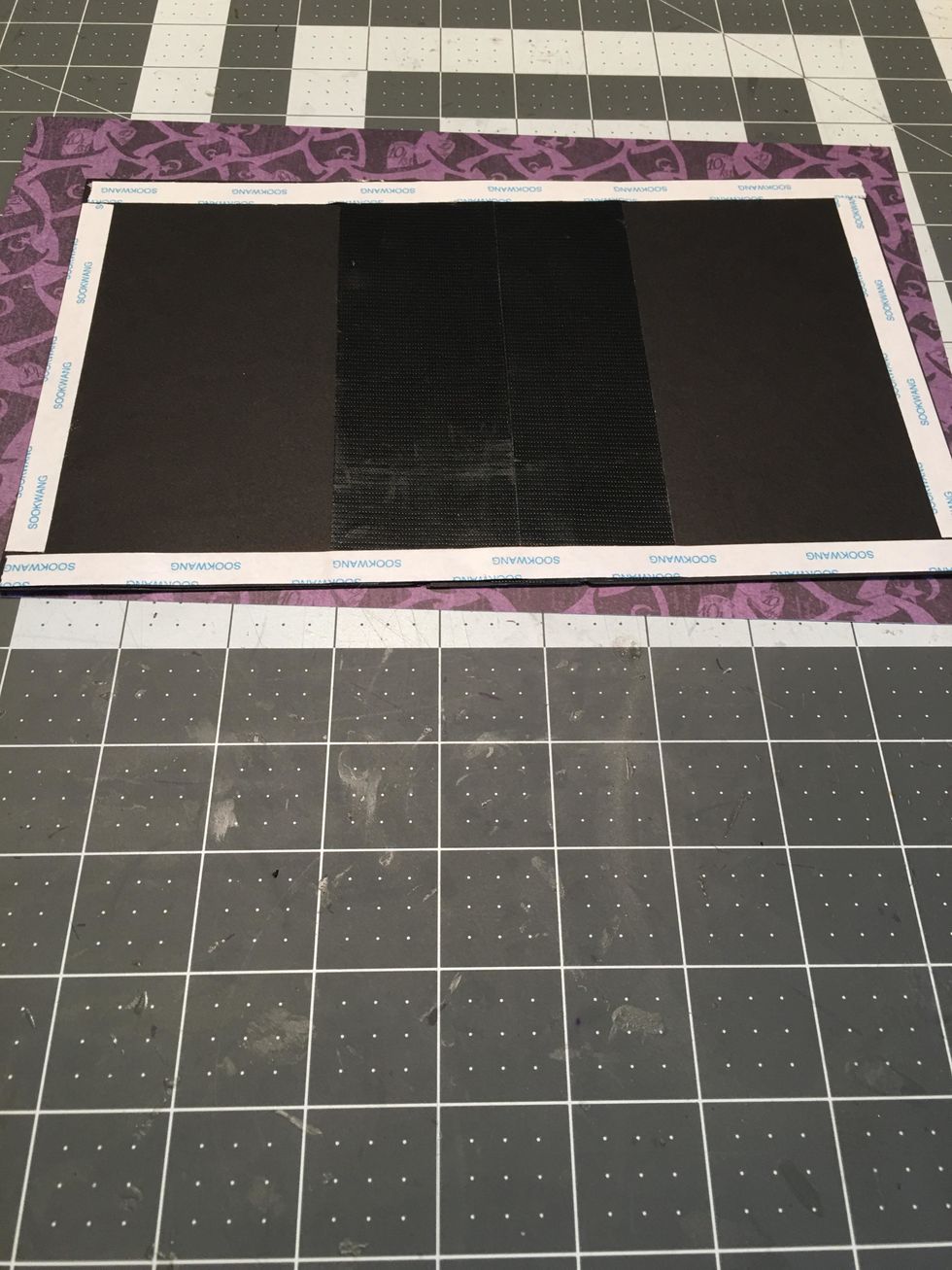 Apply scor-tape to the edges of the cover.