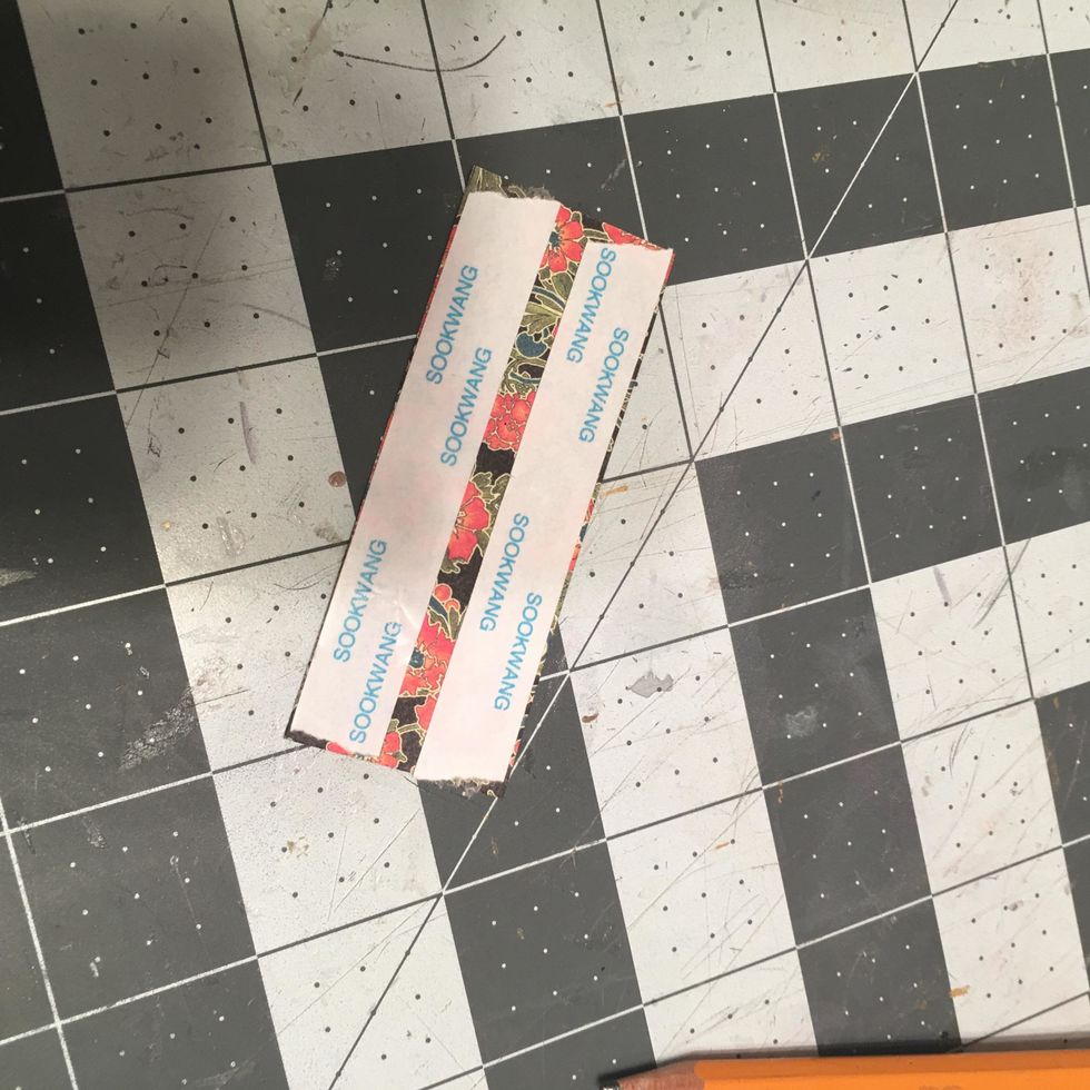 Apply scor-tape to the OTHER patterned piece and attach to the back side of the closure.