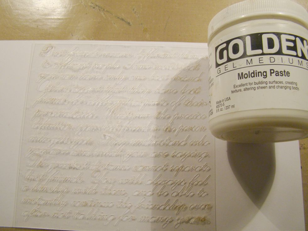 Apply script stencil to canvas using your Molding Paste. Allow to dry completely.