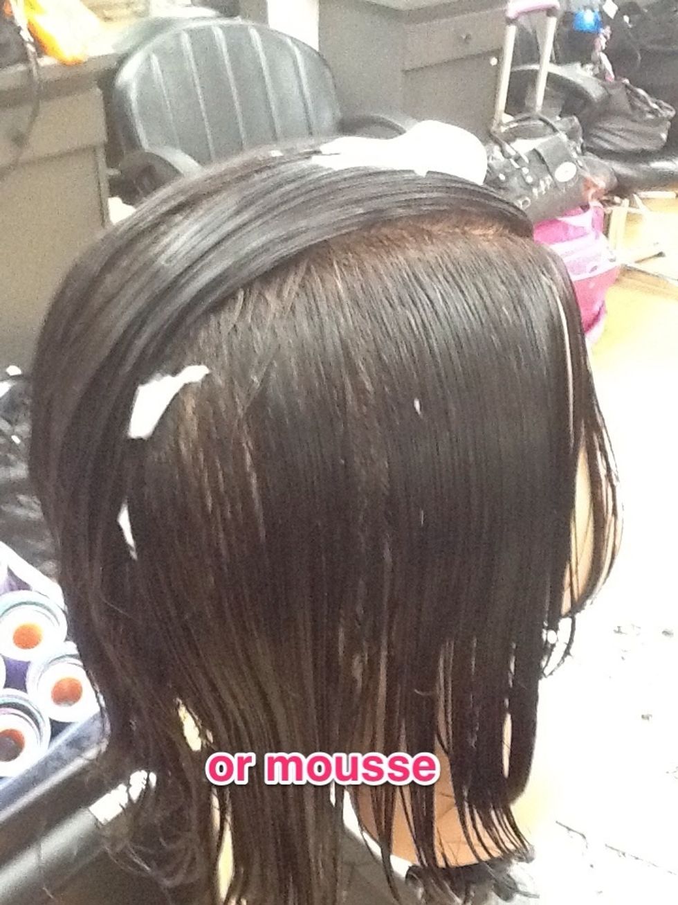 Apply setting lotion or mousse. Comb thru to distribute the setting agent...